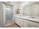 Bathroom with double vanity and walk-in shower at 9550 E Thunderbird Rd # 259, Scottsdale, AZ 85260