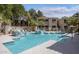 Inviting community pool with spa and comfortable lounge chairs at 9550 E Thunderbird Rd # 259, Scottsdale, AZ 85260