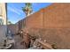 Small backyard with raised planter boxes, brick wall, and patio furniture at 10015 N 14Th St # 7, Phoenix, AZ 85020