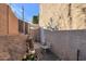 Small backyard with raised planter boxes, brick wall, and patio furniture at 10015 N 14Th St # 7, Phoenix, AZ 85020
