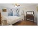 Charming bedroom with a queen bed and dresser at 10015 N 14Th St # 7, Phoenix, AZ 85020