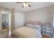 Spacious bedroom with a queen bed and ceiling fan at 10015 N 14Th St # 7, Phoenix, AZ 85020