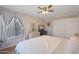 Spacious bedroom with large window, ceiling fan, and built-in dresser at 10015 N 14Th St # 7, Phoenix, AZ 85020