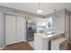Kitchen with stainless steel appliances, white cabinets, and a breakfast bar at 10015 N 14Th St # 7, Phoenix, AZ 85020