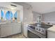 Bright kitchen featuring white cabinetry and a stainless steel stove at 10015 N 14Th St # 7, Phoenix, AZ 85020