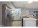 Stainless steel appliances and white cabinetry in this kitchen at 10015 N 14Th St # 7, Phoenix, AZ 85020