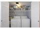 Convenient laundry room with washer, dryer, and shelving at 10015 N 14Th St # 7, Phoenix, AZ 85020