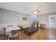 Living room with a light gray couch, coffee table, and hardwood floors at 10015 N 14Th St # 7, Phoenix, AZ 85020