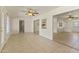 Bright living room with tile floors and views into adjacent rooms at 10521 W Prairie Hills Cir, Sun City, AZ 85351