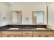 Modern bathroom boasts double vanity, marble shower, and gold fixtures at 10587 E Caron St, Scottsdale, AZ 85258
