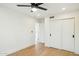 Bright bedroom with light wood floors and spacious closets at 10587 E Caron St, Scottsdale, AZ 85258