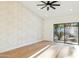 Bright bedroom with hardwood floors and sliding glass doors at 10587 E Caron St, Scottsdale, AZ 85258
