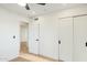 Charming bedroom with hardwood floors and sliding closet doors at 10587 E Caron St, Scottsdale, AZ 85258