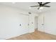 Bright bedroom with light wood floors and spacious closets at 10587 E Caron St, Scottsdale, AZ 85258