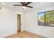 Spacious bedroom with hardwood floors, a closet, and a window at 10587 E Caron St, Scottsdale, AZ 85258