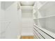 Large walk-in closet with ample shelving and hanging space at 10587 E Caron St, Scottsdale, AZ 85258