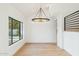 Dining room with hardwood floors and large window at 10587 E Caron St, Scottsdale, AZ 85258