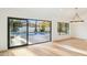 Bright dining area with large window and modern chandelier at 10587 E Caron St, Scottsdale, AZ 85258