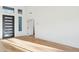 Light and bright entry with modern front door and hardwood floors at 10587 E Caron St, Scottsdale, AZ 85258
