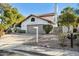 Front view of a charming home with a gray garage door at 10587 E Caron St, Scottsdale, AZ 85258