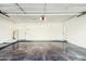 Spacious garage with epoxy flooring and extra storage at 10587 E Caron St, Scottsdale, AZ 85258