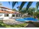 Inviting kidney shaped pool with grassy backyard at 10587 E Caron St, Scottsdale, AZ 85258