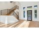 Modern staircase with metal railing and light wood steps at 10587 E Caron St, Scottsdale, AZ 85258