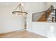 Modern staircase with metal railing and hardwood steps at 10587 E Caron St, Scottsdale, AZ 85258