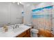 Clean bathroom with a beach-themed shower curtain and a toilet at 11899 N Spearfish St, Surprise, AZ 85388