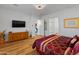 Spacious bedroom with wood floors, large windows and a walk-in closet at 11899 N Spearfish St, Surprise, AZ 85388