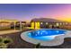 Stunning pool and backyard view at sunset at 19743 W Blue Horizons Ct, Buckeye, AZ 85326