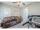 Home office or gym with a treadmill and couch at 19772 W Grant St, Buckeye, AZ 85326
