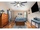 Spacious bedroom with wood floors and ceiling fan at 21836 W Hopi St, Buckeye, AZ 85326
