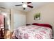 Cozy bedroom with ceiling fan and double door closet at 21836 W Hopi St, Buckeye, AZ 85326