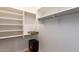 Large walk-in closet with shelving and hanging rods at 21836 W Hopi St, Buckeye, AZ 85326