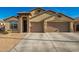 Two-story house with a three-car garage and desert landscaping at 21836 W Hopi St, Buckeye, AZ 85326