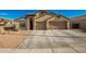 Two-car garage and desert landscaping at 21836 W Hopi St, Buckeye, AZ 85326