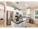 Modern kitchen with stainless steel appliances and granite countertops at 21836 W Hopi St, Buckeye, AZ 85326