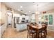 Eat-in kitchen with a center island and wooden dining table at 21836 W Hopi St, Buckeye, AZ 85326
