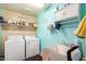 Laundry room with washer, dryer, and utility sink at 21836 W Hopi St, Buckeye, AZ 85326