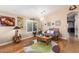 Bright living room featuring hardwood floors and comfy seating at 21836 W Hopi St, Buckeye, AZ 85326