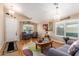 Living room with hardwood floors, ample natural light, and comfy seating at 21836 W Hopi St, Buckeye, AZ 85326