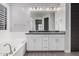 Double vanity bathroom with dark countertop at 28965 N 120Th Dr, Peoria, AZ 85383