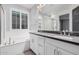 Double vanity bathroom with a soaking tub at 28965 N 120Th Dr, Peoria, AZ 85383