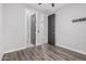 Bright bedroom with wood-look floors and double door closet at 28965 N 120Th Dr, Peoria, AZ 85383