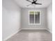 Bright bedroom with tile floors and window shutters at 28965 N 120Th Dr, Peoria, AZ 85383