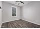 Bedroom with wood-look floors and plantation shutters at 28965 N 120Th Dr, Peoria, AZ 85383