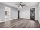 Spacious bedroom with wood-look floors and an ensuite bathroom at 28965 N 120Th Dr, Peoria, AZ 85383
