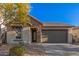 Single-story home with stone accents and a two-car garage at 28965 N 120Th Dr, Peoria, AZ 85383