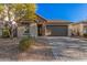 Single-story home with stone accents and a two-car garage at 28965 N 120Th Dr, Peoria, AZ 85383